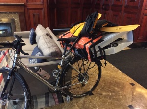 Here is what the Oru kayak plus all my gear look like loaded up on the bike.  While the kayak is not all that heavy, it is a bit awkwardly shaped for my rack.  Coincidentally, it fits perfectly squeezed under my seat and tends to stay put when secured using bungee cables.